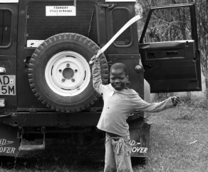 A child playfully brandishes a machete during Kenya's post-election crisis.