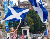 A young girl waves the Scottish flag on referendum day in George Square, Glasgow.