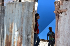 Red Cross manager Erin Grinnell tours an earthquake-destroyed village near Leogane, Haiti