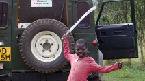 A child playfully brandishes a machete in Western Kenya at the height of the country's post-election violence.